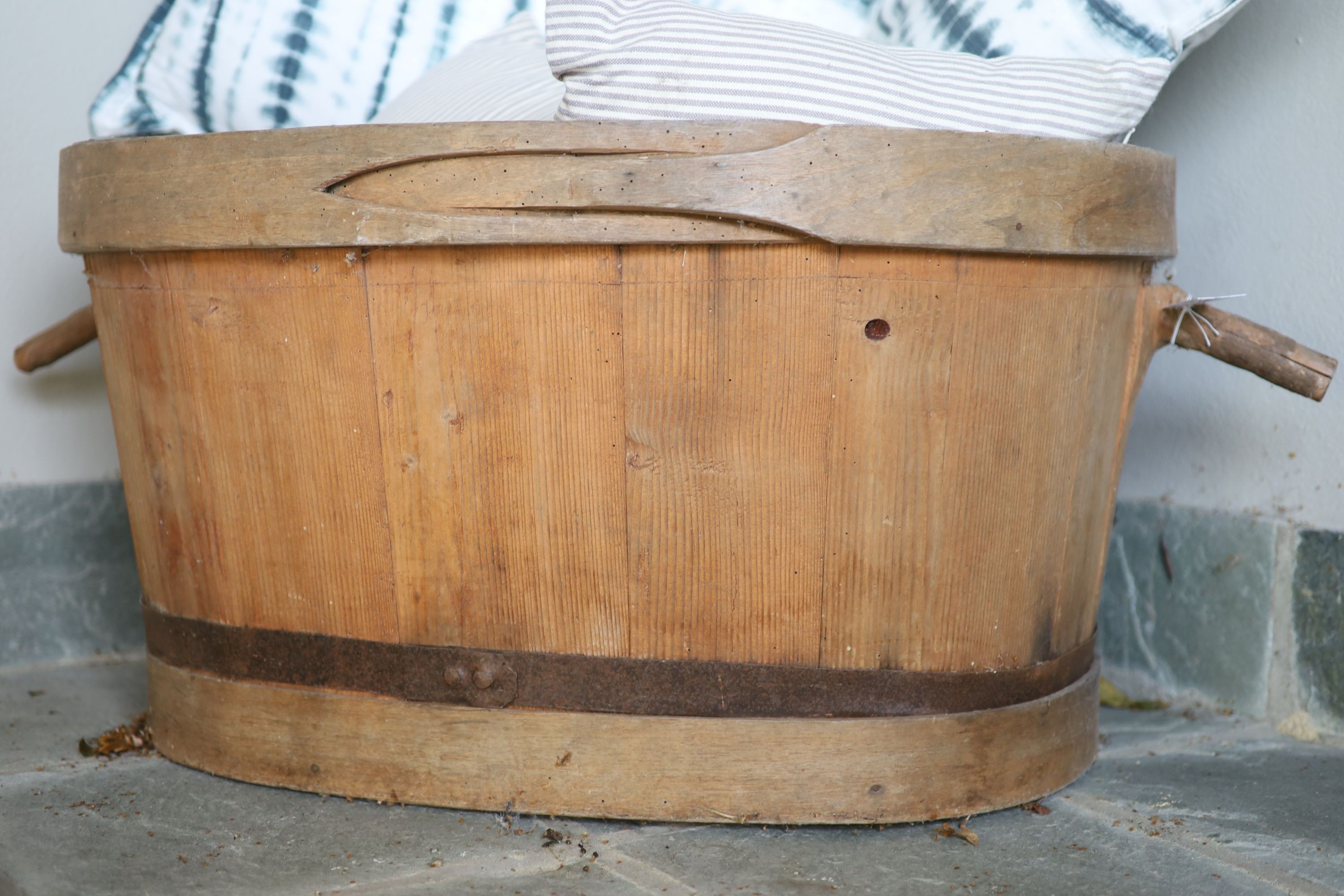 A French coopered pine grape bin, width over handles 97cm, and six assorted cushions